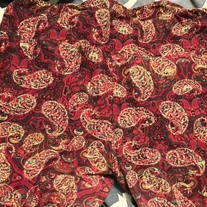 Lularoe legging. TC. Burgundy paisley print. Slight wear in thigh. No holes.